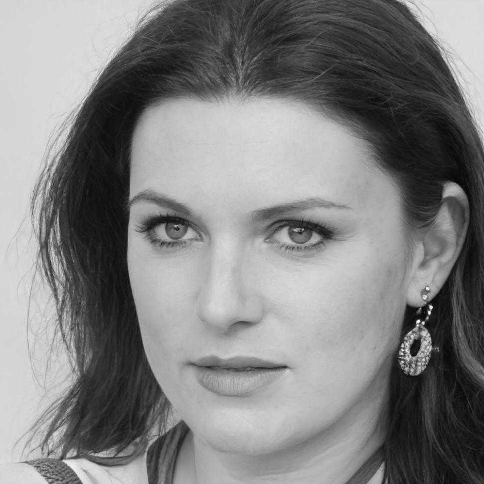 Educator reviewing financial course materials at workspace